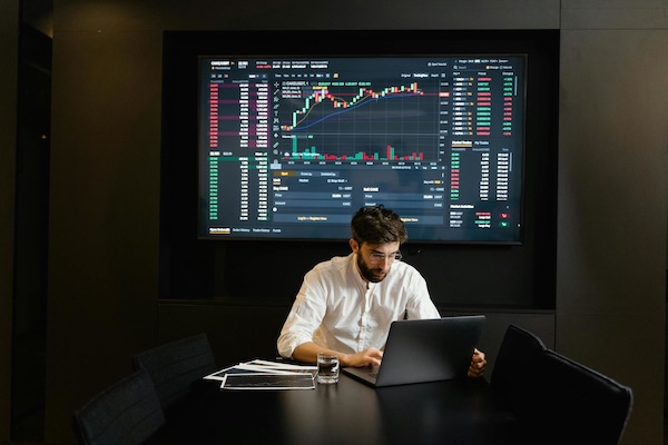 man doing SEO work on laptop